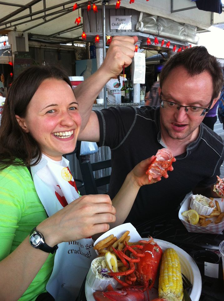 Jen and Dave in Maine killing a lobster til it's good n' dead. By Jay Curtis