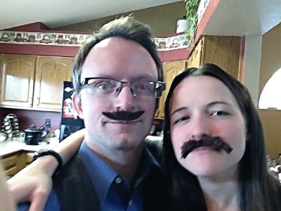 Jen and Dave sport sweet moustaches at Jen's house